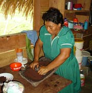 mayan woman preparing food to sale in Chichen Itza's main street.  Delicious food to local residents, not recommended for tourists