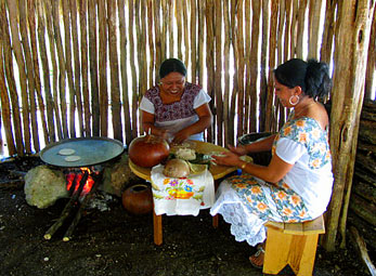 Manuela and Magali making tortillas - helping the Maya Children Nutrition Program